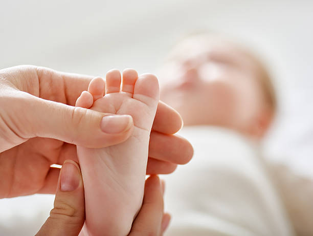 Therapist assessing child's reflexes