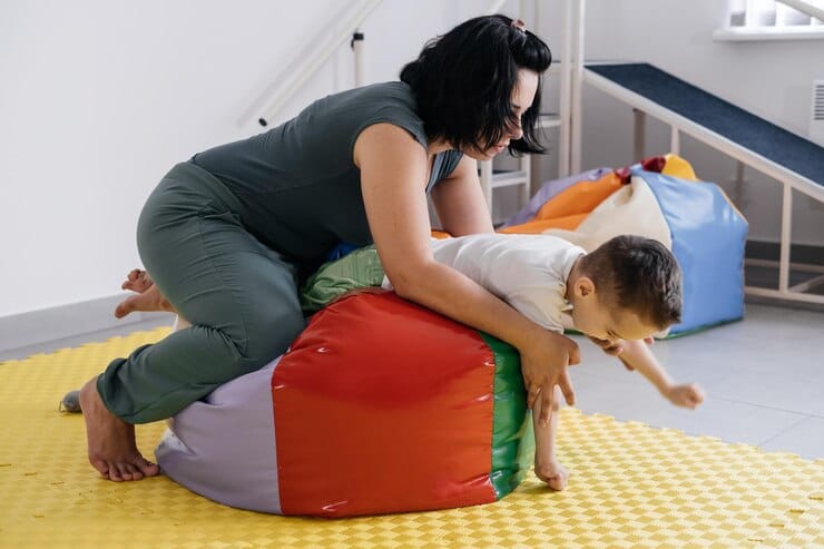 Child engaging in sensory integration therapy activities