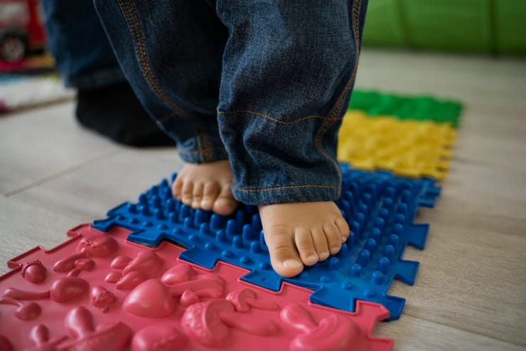 Therapist guiding sensory integration activities